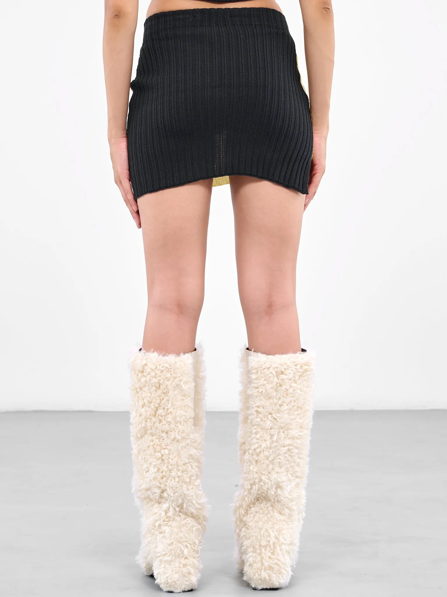 Asymmetric Rib Mini Skirt (RIBBED-MINI-SKIRT-MIMOSA-INDIG)